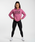 Fit woman in FIT TO TRADE hoodie